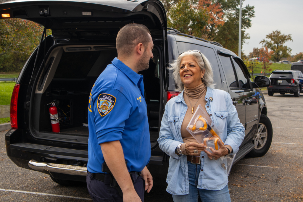 officer and cm paladino exchanging conversation